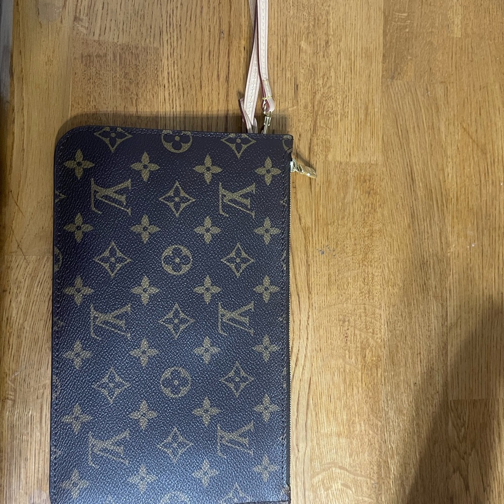 Authentic Louis Vuitton Neverfull pouch.